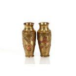 A pair of Chinese brass and copper inlaid baluster vases, decorated with prunus, 16cm high