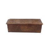 An antique carved oak coffer, of small proportions, candle box interior with iron strap hinges and
