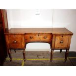 An early 19th Century mahogany breakfront sideboard, fitted cellarette drawer and deep cupboard