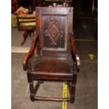 A 17th Century oak Wainscot chair, the back with lozenge shaped motif, scrolled arms above solid