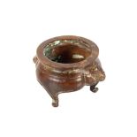 A Chinese bronze censer, having masked decoration and raised on scrolled feet, seal mark to base,