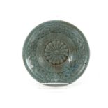 A small Celadon ground dish, decorated calligraphy, 14.5cm dia.