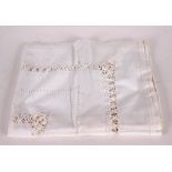 A white highly decorated drawn thread work tablecloth or bedcover, 78" long x 66" wide