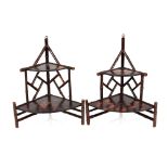 A small pair of lacquered and bamboo corner stands