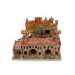A painted wooden toy fort, possibly Prisoner of War, 54cm wide