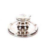 A silver capstan shaped inkwell, the lid with monogram, Birmingham 1915