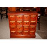 A mahogany Pharmacy cabinet, fitted twelve labelled drawers on platform plinth, 80cm wide x 77cm