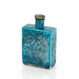 A Kashan turquoise and black pottery rectangular shaped flask and stopper, possible Iran circa. 14th