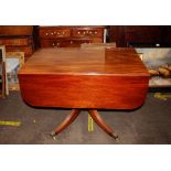 A 19th Century mahogany pedestal drop leaf supper table, fitted end drawers and raised on a