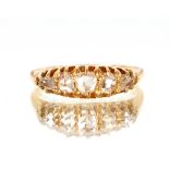 A yellow metal ring, (marks rubbed) set five graduated diamonds, size "L"