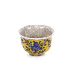 A Chinese crackle glaze yellow ground tea bowl, floral decoration and six character mark to base,