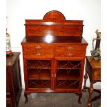 A good quality Edwardian inlaid mahogany side cabinet, having raised shelf back above four short