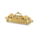 An ornate brass desk stand, with foliate decoration, 28cm