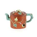 Two Chinese Yixing teapots, having coloured enamel decoration of animals and artefacts; and a