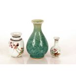 Two Chinese baluster vases, decorated exotic birds and script; and a green glazed oriental