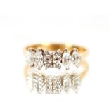 An 18ct gold ring, set with an arrangement of diamonds, size "L", 2.8gms total weight