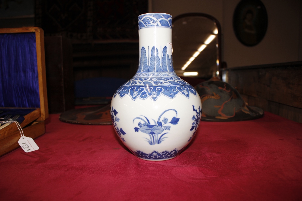 A Chinese blue and white baluster vase, with floral decoration and under glaze blue seal mark to - Image 6 of 11