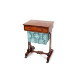 A 19th Century mahogany sewing table, fitted with a single partitioned drawer and pull out silks