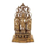 A gilt bronze model of a shrine, with three attendant figures, 27cm high