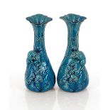 A pair of blue glazed Japanese baluster vases, decorated with rats, 24cm high