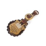 An unusual RSPCA London Cart Horse Parade merit badge, hung to a leather strap dated 1909