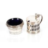 A silver drum shaped mustard pot, having pierced sides with blue glass liner; and a plated salt with