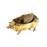 A Victorian brass pen wipe, in the form of a pig,11cm long