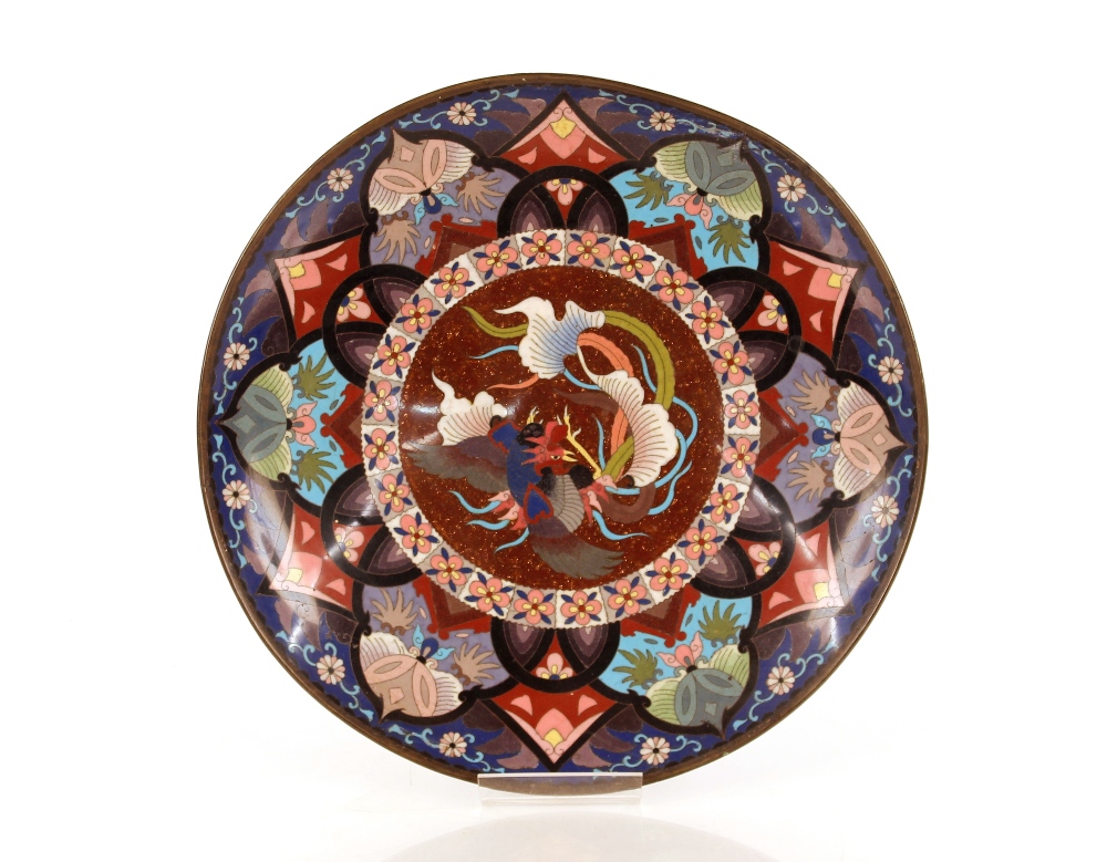 An antique cloisonné shallow dish, decorated central study of dragon and bird within multifloral