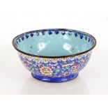 A Chinese Canton enamel bowl, having floral decoration on a blue and yellow ground, 12.5cm dia.
