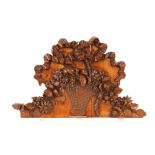 A 19th Century carved panel, of shaped form decorated with trailing basket of flowers and tied