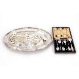 An oval silver plated dish, with glass liner; and various silver and silver plated teaspoons,