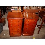 A pair of Victorian mahogany pot cupboards, with mock four drawer fronts, raised on platform
