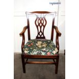 A set of eight mahogany Chippendale style dining chairs, having pierced splat backs, upholstered