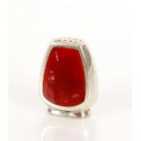 A silver and red enamel pepper