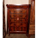 A 19th century figured mahogany continental chest of drawers, fitted with a blind frieze drawer