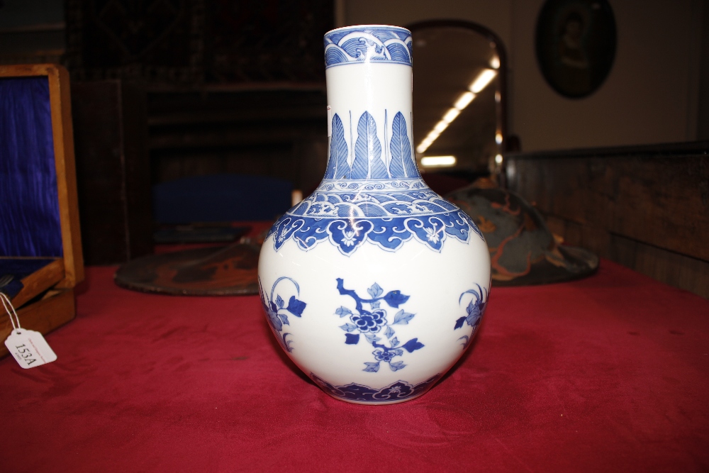 A Chinese blue and white baluster vase, with floral decoration and under glaze blue seal mark to - Image 4 of 11