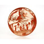 A Japanese Kutani style shallow dish, decorated figures in exotic landscape setting, 31cm dia.