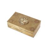 A brass mounted and wooden lined Oriental cigarette box, decorated with motifs and hard stone