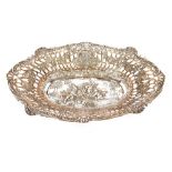 An ornate continental bread basket, with pierced foliate and game bird borders, trailing vines and