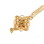 A 9ct gold pendant, set with seed pearls and peridot hung to a fine link chain, 6gms total weight