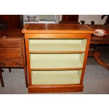 A walnut and cross banded open fronted bookcase, fitted two adjustable shelves, 81.5cm wide x 96cm