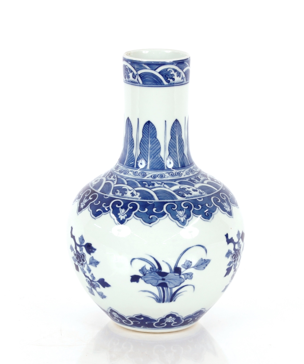 A Chinese blue and white baluster vase, with floral decoration and under glaze blue seal mark to