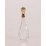 An 18th Century yellow metal topped crystal scent flask, the top finely engraved Poincon marks, (