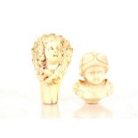 Two finely carved 19th Century ivory studies of children's heads, possibly seal terminals (2)