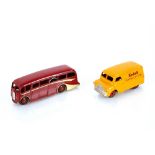 An old Dinky toy luxury coach in red / yellow; tog