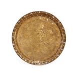 An Eastern brass and white metal inlaid tray, having foliate engraved decoration, 40cm dia.