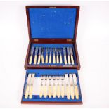 A mahogany cased set of twelve fish forks and eleven fish knives, Sheffield 1897/1898, with