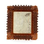 An unusual antique leather covered mirror, 48cm x 45cm