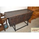 An antique oak dough bin