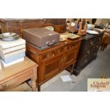 An oak mirrored back sideboard fitted two drawers